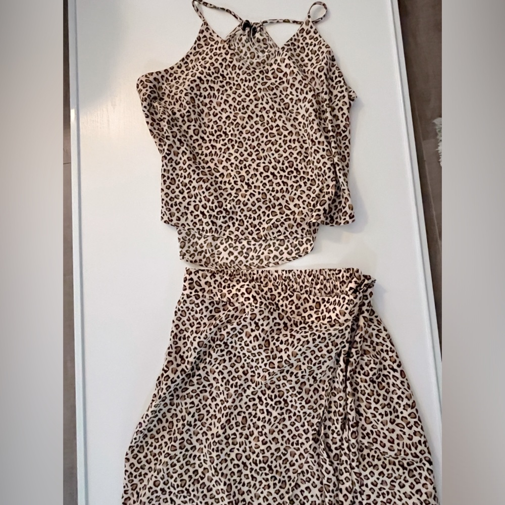 Two piece, soft pink leopard print, razor back tank and faux sarong skirt